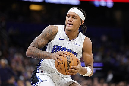 Nov 26, 2023; Orlando, Florida, USA;  Orlando Magic forward Paolo Banchero (5) controls the ball against the Charlotte Hornets in the second quarter at Amway Center. Mandatory Credit: Nathan Ray Seebeck-USA TODAY Sports