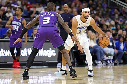 Nov 26, 2023; Orlando, Florida, USA;  Orlando Magic guard Jalen Suggs (4) is guarded by Charlotte Hornets guard Terry Rozier (3) in the second quarter at Amway Center. Mandatory Credit: Nathan Ray Seebeck-USA TODAY Sports