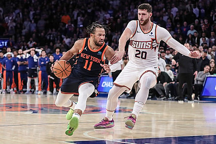 Nov 26, 2023; New York, New York, USA; New York Knicks guard Jalen Brunson (11) drives past Phoenix Suns center Jusuf Nurkic (20) in the fourth quarter at Madison Square Garden. Mandatory Credit: Wendell Cruz-USA TODAY Sports