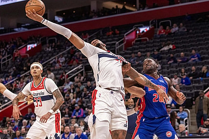 Nov 27, 2023; Detroit, Michigan, USA; Detroit Pistons center Isaiah Stewart (28) and Washington Wizards center Daniel Gafford (21) battle for the ball during the first half at Little Caesars Arena. Mandatory Credit: David Reginek-USA TODAY Sports
