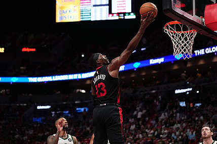 Nov 28, 2023; Miami, Florida, USA; Miami Heat center Bam Adebayo (13) puts up a shot against the Milwaukee Bucks during the first half at Kaseya Center. Mandatory Credit: Jasen Vinlove-USA TODAY Sports