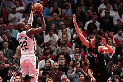 Nov 28, 2023; Miami, Florida, USA; Milwaukee Bucks forward Khris Middleton (22) shoots over Miami Heat guard Jaime Jaquez Jr. (11) during the first half at Kaseya Center. Mandatory Credit: Jasen Vinlove-USA TODAY Sports