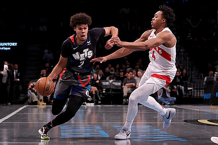 Nov 28, 2023; Brooklyn, New York, USA; Brooklyn Nets forward Cameron Johnson (2) controls the ball against Toronto Raptors forward Scottie Barnes (4) during the second quarter at Barclays Center. Mandatory Credit: Brad Penner-USA TODAY Sports