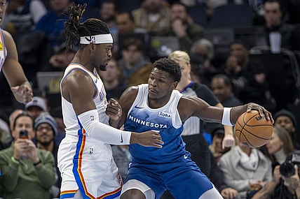 Nov 28, 2023; Minneapolis, Minnesota, USA; Minnesota Timberwolves guard Anthony Edwards (5) backs toward the basket as Oklahoma City Thunder guard Luguentz Dort (5) plays defense in the first half at Target Center. Mandatory Credit: Jesse Johnson-USA TODAY Sports