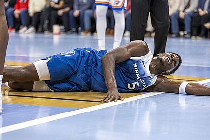 Nov 28, 2023; Minneapolis, Minnesota, USA; Minnesota Timberwolves guard Anthony Edwards (5) reacts after landing on the floor against the Oklahoma City Thunder in the second half at Target Center. Mandatory Credit: Jesse Johnson-USA TODAY Sports