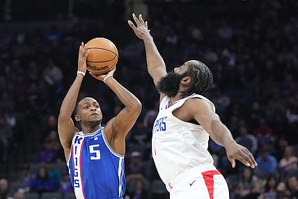 November 29, 2023; Sacramento, California, USA; Sacramento Kings guard De'Aaron Fox (5) shoots the basketball against LA Clippers guard James Harden (1) during the first quarter at Golden 1 Center. Mandatory Credit: Kyle Terada-USA TODAY Sports