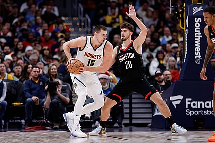 Nov 29, 2023; Denver, Colorado, USA; Denver Nuggets center Nikola Jokic (15) controls the ball as Houston Rockets center Alperen Sengun (28) guards in the second quarter at Ball Arena. Mandatory Credit: Isaiah J. Downing-USA TODAY Sports