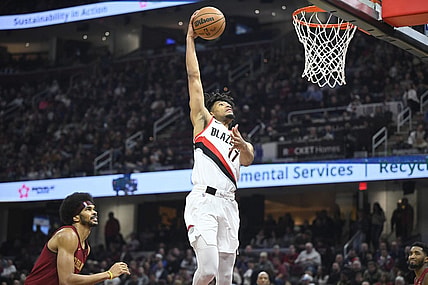 Nov 30, 2023; Cleveland, Ohio, USA; Portland Trail Blazers guard Shaedon Sharpe (17) dunks beside Cleveland Cavaliers center Jarrett Allen (31) in the second quarter at Rocket Mortgage FieldHouse. Mandatory Credit: David Richard-USA TODAY Sports