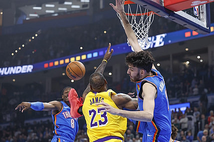 Nov 30, 2023; Oklahoma City, Oklahoma, USA; Los Angeles Lakers forward LeBron James (23), Oklahoma City Thunder forward Chet Holmgren (7) and forward Jalen Williams (8) fight for a rebound during the first quarter at Paycom Center. Mandatory Credit: Alonzo Adams-USA TODAY Sports