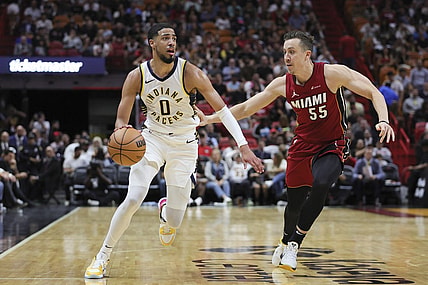 Nov 30, 2023; Miami, Florida, USA; Indiana Pacers guard Tyrese Haliburton (0) drives to the basket against Miami Heat forward Duncan Robinson (55) during the second quarter at Kaseya Center. Mandatory Credit: Sam Navarro-USA TODAY Sports