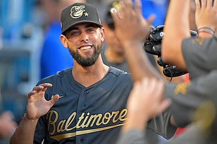 Jul 19, 2022; Los Angeles, California, USA; American League relief pitcher Jorge Lopez (48) of the Baltimore Orioles smiles as he gets high fives in the dugout after pitching against the National League during the seventh inning of the 2022 MLB All Star Game at Dodger Stadium. Mandatory Credit: Jayne Kamin-Oncea-USA TODAY Sports