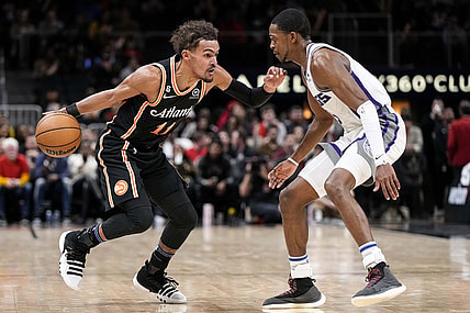 Nov 23, 2022; Atlanta, Georgia, USA; Atlanta Hawks guard Trae Young (11) dribbles against Sacramento Kings guard De'Aaron Fox (5) during the second half at State Farm Arena. Mandatory Credit: Dale Zanine-USA TODAY Sports