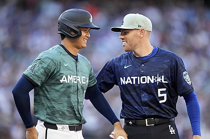 Jul 11, 2023; Seattle, Washington, USA; American League designated hitter/pitcher  Shohei Ohtani  of the Los Angeles Angels of Anaheim (17) reacts with National League first baseman  Freddie Freeman  of the Los Angeles Dodgers (5) during the fifth inning at T-Mobile Park. Mandatory Credit: Stephen Brashear-USA TODAY Sports