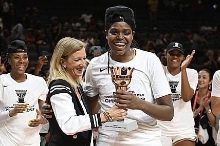 Aug 15, 2023; Las Vegas, Nevada, USA; WNBA Commissioner Cathy Engelbert hands New York Liberty forward Jonquel Jones the MVP trophy for the Commissioner   s Cup Championship game after defeating the Las Vegas Aces at Michelob Ultra Arena. Mandatory Credit: Candice Ward-USA TODAY Sports