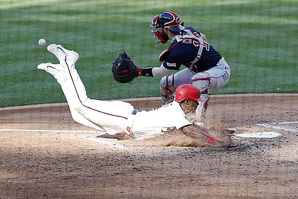 Aug 17, 2023; Washington, District of Columbia, USA; Washington Nationals second baseman Jeter Downs (3) scores a run ahead of a tag by Boston Red Sox catcher Connor Wong (12) on a two run double by Nationals designated hitter Joey Meneses (not pictured) during the fifth inning at Nationals Park. Mandatory Credit: Geoff Burke-USA TODAY Sports
