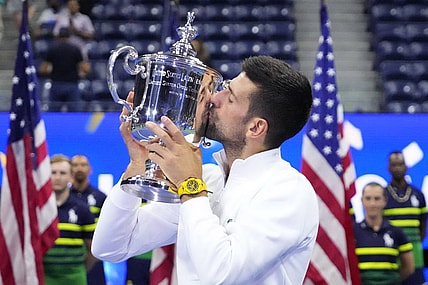 Sep 10, 2023; Flushing, NY, USA; Novak Djokovic of Serbia celebrates with the championship trophy after his match against Daniil Medvedev (not pictured) in the men's singles final on day fourteen of the 2023 U.S. Open tennis tournament at USTA Billie Jean King National Tennis Center. Mandatory Credit: Robert Deutsch-USA TODAY Sports