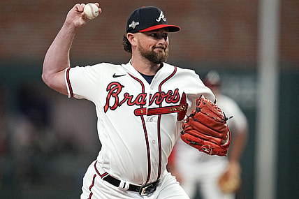 Oct 9, 2023; Cumberland, Georgia, USA; Atlanta Braves relief pitcher Kirby Yates (22) pitches during the fifth inning against the Philadelphia Phillies in game two of the NLDS for the 2023 MLB playoffs at Truist Park. Mandatory Credit: Dale Zanine-USA TODAY Sports