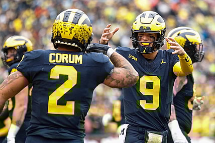 Michigan quarterback J.J. McCarthy celebrates a touchdown against Indiana scored by running back Blake Corum during the first half of U-M's 52-7 win over Indiana on Saturday, Oct. 14, 2023, in Ann Arbor.