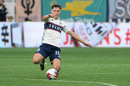 Oct 21, 2023; Vancouver, British Columbia, CAN;  Vancouver Whitecaps FC midfielder Sebastian Berhalter (16) reaches for the ball during the first half against the Los Angeles FC at BC Place. Mandatory Credit: Anne-Marie Sorvin-USA TODAY Sports
