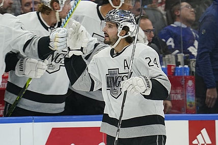 Oct 31, 2023; Toronto, Ontario, CAN; Los Angeles  Kings forward Phillip Danault (24) gets congratulated after scoring against the Toronto Maple Leafs during the first period at Scotiabank Arena. Mandatory Credit: John E. Sokolowski-USA TODAY Sports