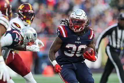 Nov 5, 2023; Foxborough, Massachusetts, USA; New England Patriots running back Rhamondre Stevenson (38) runs the ball during the second half against the Washington Commanders at Gillette Stadium. Mandatory Credit: Paul Rutherford-USA TODAY Sports