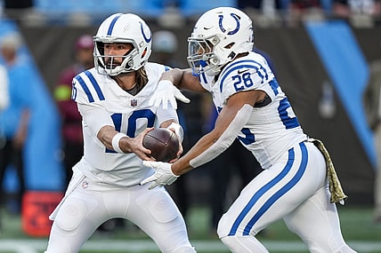 Nov 5, 2023; Charlotte, North Carolina, USA; Indianapolis Colts quarterback Gardner Minshew (10) hands off to running back Jonathan Taylor (28) during the first quarter against the Carolina Panthers at Bank of America Stadium. Mandatory Credit: Jim Dedmon-USA TODAY Sports