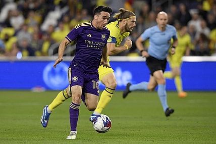 Nov 7, 2023; Nashville, Tennessee, USA; Orlando City midfielder Mauricio Pereyra (10) controls the ball against the Nashville SC in the first half at Geodis Park. Mandatory Credit: Steve Roberts-USA TODAY Sports