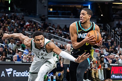Nov 9, 2023; Indianapolis, Indiana, USA; Indiana Pacers guard Tyrese Haliburton (0) dribbles the ball while Milwaukee Bucks forward Giannis Antetokounmpo (34) defends in the second half at Gainbridge Fieldhouse. Mandatory Credit: Trevor Ruszkowski-USA TODAY Sports