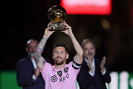 Nov 10, 2023; Lauderdale, FL, USA; Inter Miami forward Lionel Messi (10) poses with the Ballon d'Or trophy before the game against New York City at DRV PNK Stadium. Mandatory Credit: Sam Navarro-USA TODAY Sports