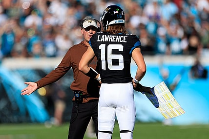 Jacksonville Jaguars head coach Doug Pederson talks with quarterback Trevor Lawrence (16) during the second quarter an NFL football matchup Sunday, Nov. 19, 2023 at EverBank Stadium in Jacksonville, Fla. The Jacksonville Jaguars defeated the Tennessee Titans 34-14. [Corey Perrine/Florida Times-Union]