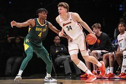 Nov 22, 2023; Brooklyn, NY, USA;  Oregon State Beavers forward Tyler Bilodeau (34) and Baylor Bears guard Ja'Kobe Walter (4) at Barclay Center. Mandatory Credit: Wendell Cruz-USA TODAY Sports