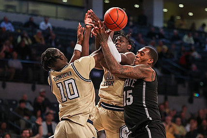 Nov 28, 2023; Atlanta, Georgia, USA; Georgia Tech Yellow Jackets forward Ebenezer Dowuona (10) and forward Baye Ndongo (11) reach for a rebound with Mississippi State Bulldogs forward Jimmy Bell Jr. (15) in the second half at McCamish Pavilion. Mandatory Credit: Brett Davis-USA TODAY Sports