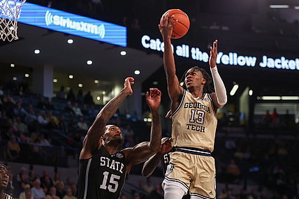 Nov 28, 2023; Atlanta, Georgia, USA; Georgia Tech Yellow Jackets guard Miles Kelly (13) shoots over Mississippi State Bulldogs forward Jimmy Bell Jr. (15) in the second half at McCamish Pavilion. Mandatory Credit: Brett Davis-USA TODAY Sports