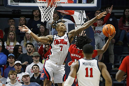 Nov 28, 2023; Oxford, Mississippi, USA; Mississippi Rebels guard Allen Flanigan (7) blocks the shot of North Carolina State Wolfpack guard Dennis Parker, Jr. (11) during the second half at The Sandy and John Black Pavilion at Ole Miss. Mandatory Credit: Petre Thomas-USA TODAY Sports