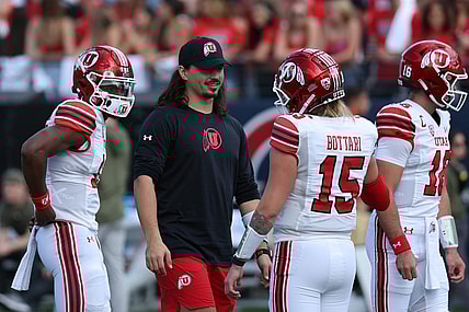 Nov 18, 2023; Tucson, Arizona, USA; Utah Utes quarterback Cameron Rising (middle) on the field during warms ups with quarterback Bryson Barnes (16), quarterback Nate Johnson (13) and quarterback Luke Bottari (15) at Arizona Stadium. Mandatory Credit: Zachary BonDurant-USA TODAY Sports