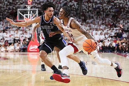 Nov 29, 2023; Fayetteville, Arkansas, USA; Arkansas Razorbacks guard Khalif Battle (0) drives against Duke Blue Devils Jared McCain (0) during the second half at Bud Walton Arena. Arkansas won 80-75. Mandatory Credit: Nelson Chenault-USA TODAY Sports