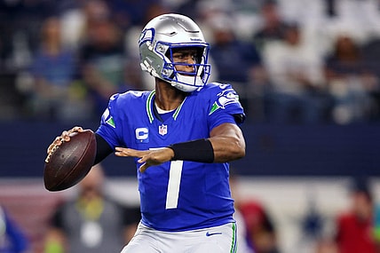 Nov 30, 2023; Arlington, Texas, USA; Seattle Seahawks quarterback Geno Smith (7) looks to pass against the Dallas Cowboys during the first half at AT&T Stadium. Mandatory Credit: Tim Heitman-USA TODAY Sports