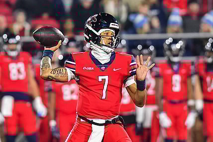 Dec 1, 2023; Lynchburg, VA, USA; Liberty Flames quarterback Kaidon Salter (7) throws a pass during the first quarter against the New Mexico State Aggies at Williams Stadium. Mandatory Credit: Brian Bishop-USA TODAY Sports