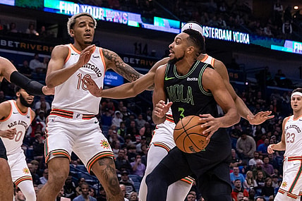 Dec 1, 2023; New Orleans, Louisiana, USA; New Orleans Pelicans guard CJ McCollum (3) dribbles against San Antonio Spurs guard Malaki Branham (22) during the first half at the Smoothie King Center. Mandatory Credit: Stephen Lew-USA TODAY Sports