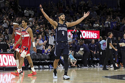 Dec 1, 2023; Orlando, Florida, USA;  Orlando Magic guard Jalen Suggs (4) reacts during a time out against the Washington Wizards in the fourth quarter at Amway Center. Mandatory Credit: Nathan Ray Seebeck-USA TODAY Sports
