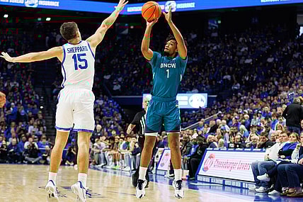 Dec 2, 2023; Lexington, Kentucky, USA; North Carolina-Wilmington Seahawks guard Donovan Newby (1) shoots the ball against Kentucky Wildcats guard Reed Sheppard (15) during the first half at Rupp Arena at Central Bank Center. Mandatory Credit: Jordan Prather-USA TODAY Sports