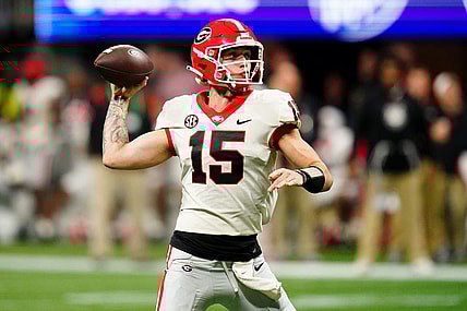 Dec 2, 2023; Atlanta, GA, USA;  Georgia Bulldogs quarterback Carson Beck (15) throws a pass against the Alabama Crimson Tide in the third quarter of the SEC Championship at Mercedes-Benz Stadium. Mandatory Credit: John David Mercer-USA TODAY Sports