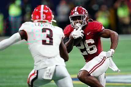 Dec 2, 2023; Atlanta, GA, USA;  Alabama Crimson Tide running back Jam Miller (26) runs against Georgia Bulldogs defensive back Kamari Lassiter (3) in the fourth quarter of the SEC Championship at Mercedes-Benz Stadium. Mandatory Credit: John David Mercer-USA TODAY Sports