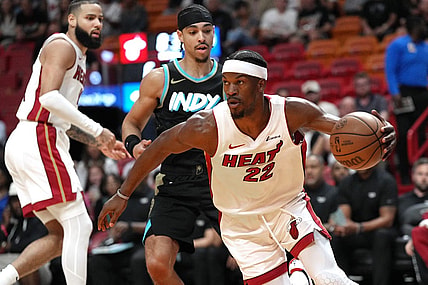 Dec 2, 2023; Miami, Florida, USA;  Miami Heat forward Jimmy Butler (22) grabs a rebound against the Indiana Pacers during the first half at Kaseya Center. Mandatory Credit: Jim Rassol-USA TODAY Sports