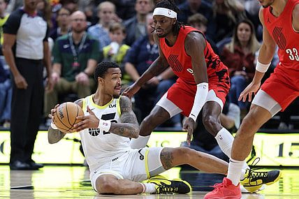 Dec 2, 2023; Salt Lake City, Utah, USA; Utah Jazz forward John Collins (20) plays a ball from the floor against Portland Trail Blazers forward Jerami Grant (9) during the first quarter at Delta Center. Mandatory Credit: Rob Gray-USA TODAY Sports