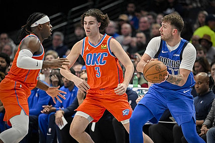 Dec 2, 2023; Dallas, Texas, USA; Dallas Mavericks guard Luka Doncic (77) looks to pass the ball past Oklahoma City Thunder guard Josh Giddey (3) during the second quarter at the American Airlines Center. Mandatory Credit: Jerome Miron-USA TODAY Sports