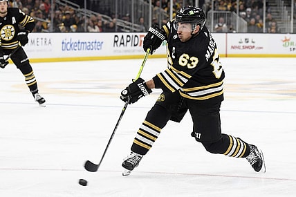 Dec 3, 2023; Boston, Massachusetts, USA; Boston Bruins left wing Brad Marchand (63) shoots the puck during the third period against the Columbus Blue Jackets at TD Garden. Mandatory Credit: Bob DeChiara-USA TODAY Sports