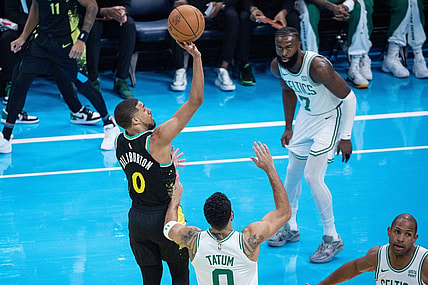 Dec 4, 2023; Indianapolis, Indiana, USA; Indiana Pacers guard Tyrese Haliburton (0) shoots while Boston Celtics forward Jayson Tatum (0)  defends in the first quarter at Gainbridge Fieldhouse. Mandatory Credit: Trevor Ruszkowski-USA TODAY Sports