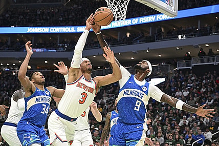 Dec 5, 2023; Milwaukee, Wisconsin, USA; New York Knicks guard Josh Hart (3) and Milwaukee Bucks forward Bobby Portis (9) battle for a rebound in the first half at Fiserv Forum. Mandatory Credit: Michael McLoone-USA TODAY Sports