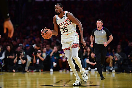 Dec 5, 2023; Los Angeles, California, USA; Phoenix Suns forward Kevin Durant (35) moves the ball up court against the Los Angeles Lakers during the second half of the In Season Tournament quarterfinal at Crypto.com Arena. Mandatory Credit: Gary A. Vasquez-USA TODAY Sports